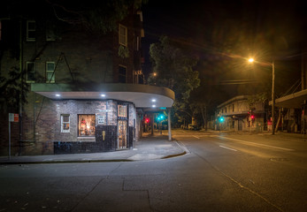 generic old store at night on an empty street
