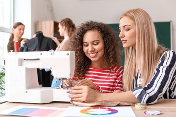 Young women during tailor's class in atelier