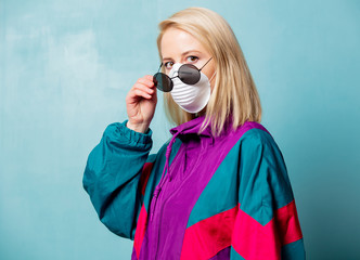 Blonde woman in face mask and 90s style clothes