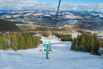 chairlift on a background of hills
