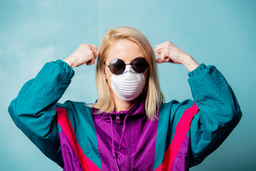Blonde woman in face mask and 90s style clothes