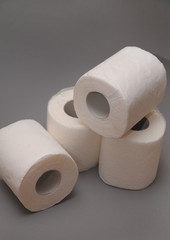  Toilet paper on grey background.