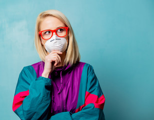 Style blonde woman in 90s clothes and face mask