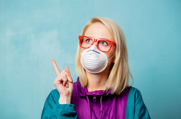 Style blonde woman in 90s clothes and face mask