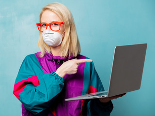 Style blonde woman in 90s clothes and face mask holds notebook
