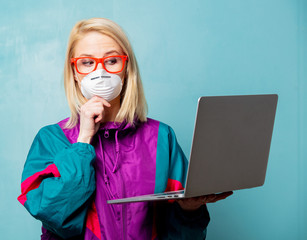 Style blonde woman in 90s clothes and face mask holds notebook