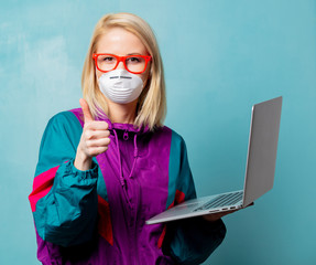 Style blonde woman in 90s clothes and face mask holds notebook