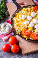 delicious pasta and cheese casserole in a cast iron skillet