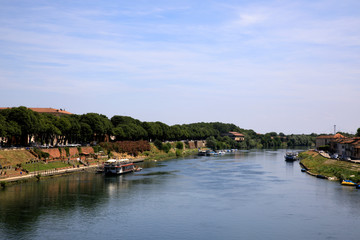 Fototapeta na wymiar Pavia (PV), Italy - June 09, 2018: Ticino river in Pavia, Pavia, Lombardy, Italy