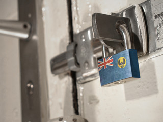 A bolted door secured by a padlock with the national flag of South Australia on it.(series)