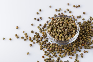 green peppers in glass bowl on white background