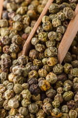 green peppers in wooden box on white background