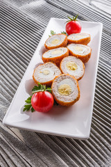 Scotch egg meat balls on rustic wooden background