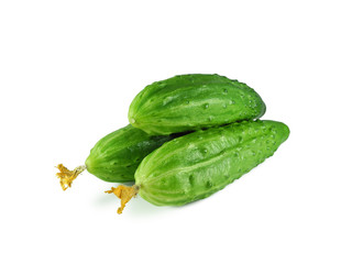  Three fresh cucumbers with dry flowers isolated on white background