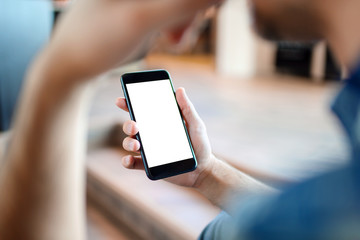 Man holding a smartphone in hand. Closeup shot. Clipping path included.