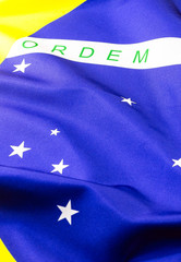 detail of the flag of brazil, in macro photography. Image with concept of patriotism, nationalism or beloved homeland.