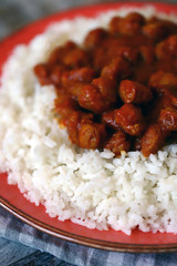 Vegan curry rice on a plate. White rice with curry with soy meat. Vegan lunch. Healthy food. Diet.