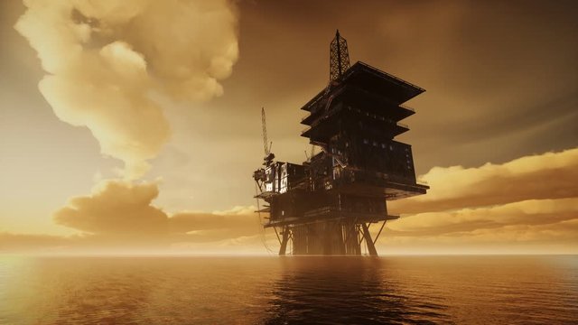 Offshore Jack Up Rig in The Middle of The Sea at Sunset Time