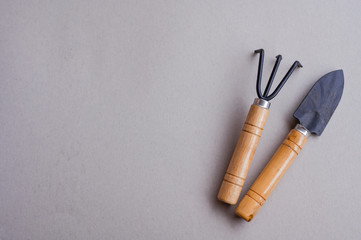 Tools for the garden on a gray background. Top view. Copy space. Flat lay