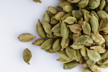 fragrant green cardamom on a white acrylic background