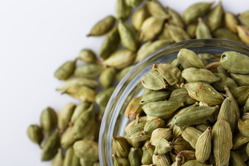 fragrant green cardamom on a white acrylic background