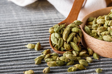 fragrant green cardamom on a wooden rustic background