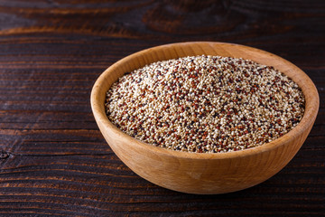 mix of quinoa grains on dark wooden rustic background