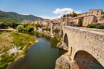 Fototapeta na wymiar Old bridge over the river Fluvia in medieval town of Besalu, province Girona, Spain