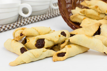 Traditional Brazilian buttered cookies stuffed with guava paste called goiabinha ou beliscão in white breakfest table