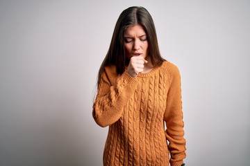 Young beautiful woman with blue eyes wearing casual sweater standing over white background feeling unwell and coughing as symptom for cold or bronchitis. Health care concept.