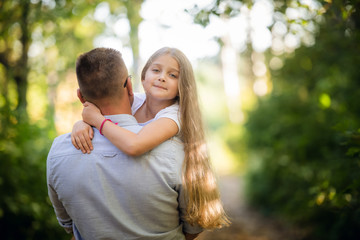 Fototapeta premium Father with her daughter in the park
