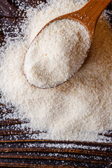natural organic semolina on dark wooden rustic background