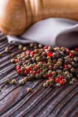 mix of peppercorns on a dark wooden rustic background