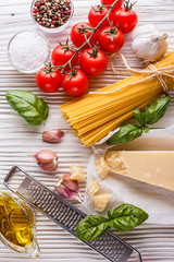 concept of traditional italian pasta with tomatoes and basil