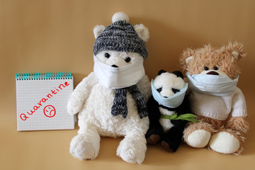 Soft toys bears and panda in medical masks on a beige background. Schools and kindergartens are under quarantine. Home schooling. Quarantine sign.