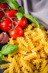 concept of traditional italian pasta with tomatoes and basil