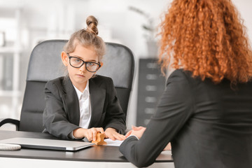 Little businesswoman working with client in office