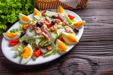 tuna salad on dark wooden rustic background