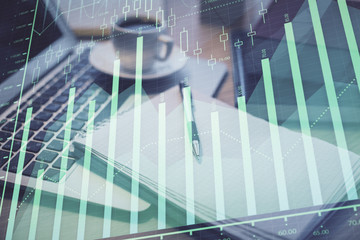 Double exposure of forex chart drawing and desktop with coffee and items on table background. Concept of financial market trading
