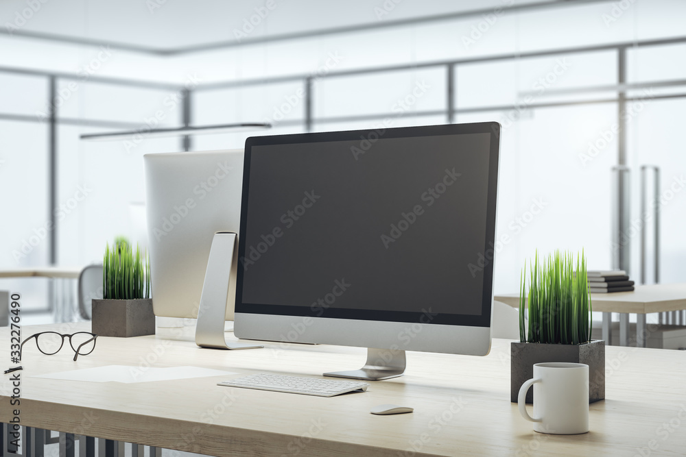 Poster computer on designer workplace with blank screen