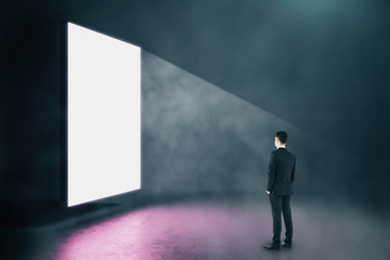 Businessman looking on blank glowing banner