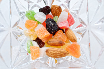 top view of Mixed dried fruits in glass bowl.