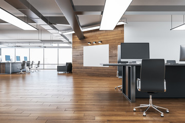 Contemporary coworking office with blank poster on wall.