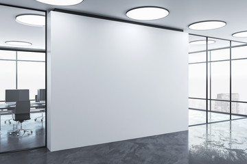Blank wall in office interior.