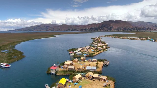 Aerial view of Uros Floating Islands (Spanish: Islas Uros ) on Lake Titicaca, the highest navigable lake in the world, near Puno, Peru, South America.