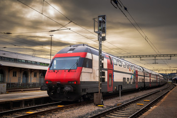 Obraz premium Red train on a train station in Konstanz, town in Germany