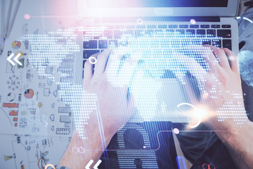 Multi exposure of man's hands typing over computer keyboard and world map hologram drawing. Top view. Technology concept.