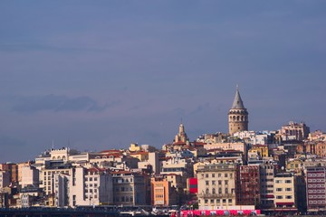 Fototapeta na wymiar Galata Tower over the skyline of Istanbul, Turkey, on a sunny afternoon.