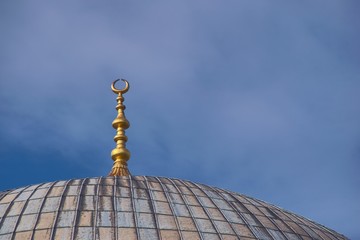 Fototapeta na wymiar Golden ornament on top of the dome of Hagia Sophia, in Istanbul, Turkey. Architectural detail.