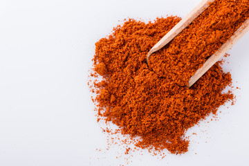 aromatic spicy chili powder on a white background